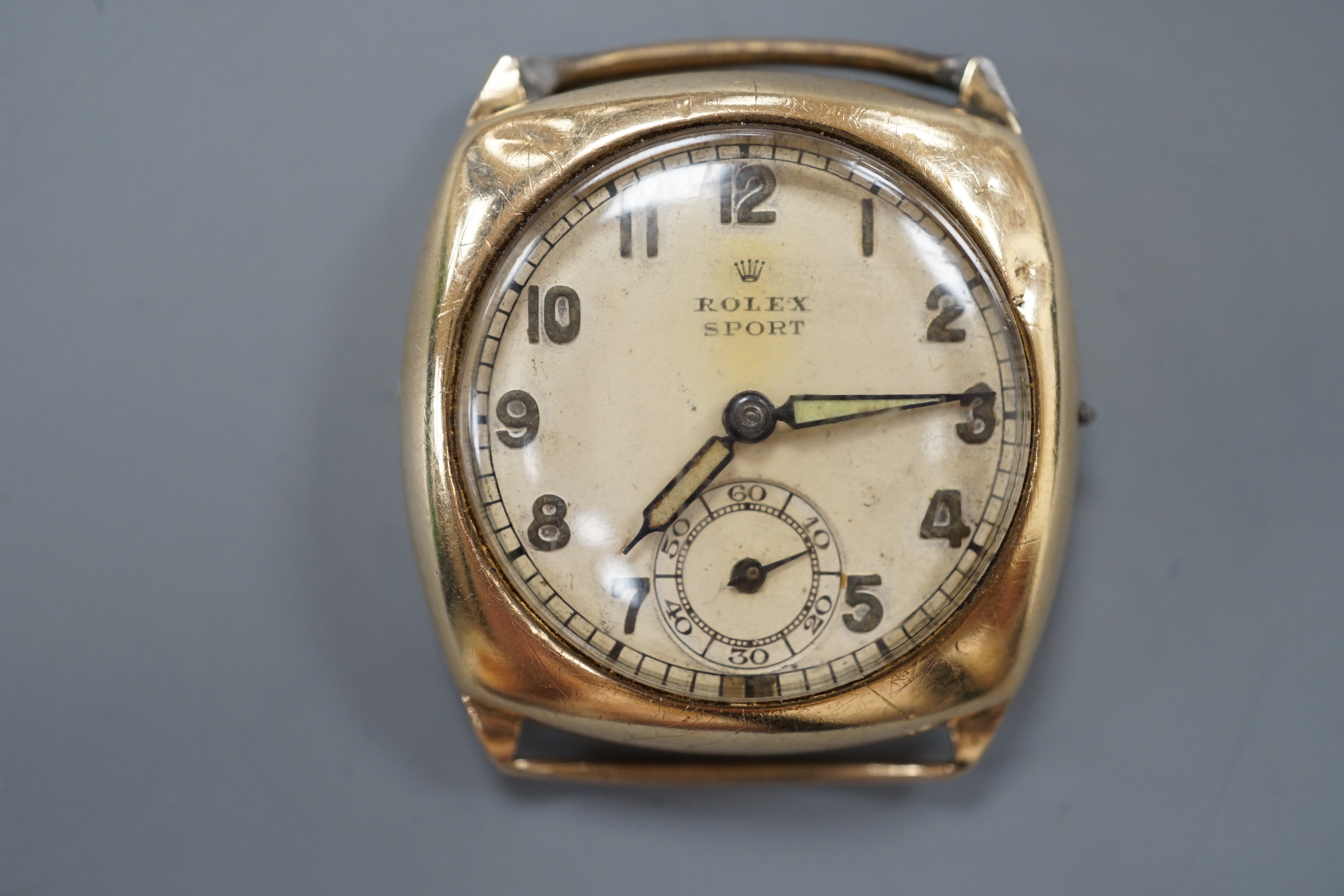 A gentleman's 1940's 9ct gold Rolex Sport manual wind wrist watch, with Arabic dial and subsidiary seconds, case diameter 30mm, lacking winding crown and strap, gross weight 16.7 grams.